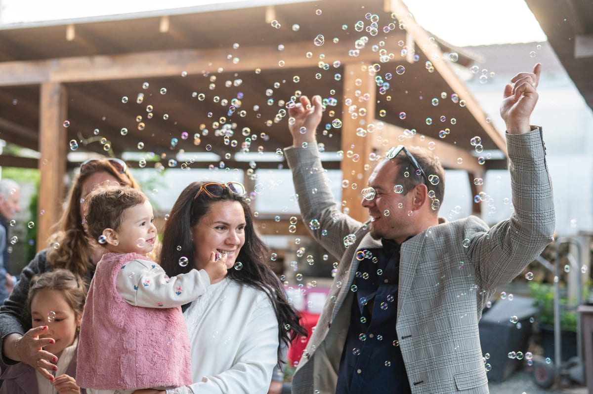Bubble Machine hire — family celebrates joyful moment with bubbles outdo | Panda Party Hire Hire bubble machine — family celebrates joyful moment with bubbles outdo for parties and events in Johannesburg, Sandton and Randburg
