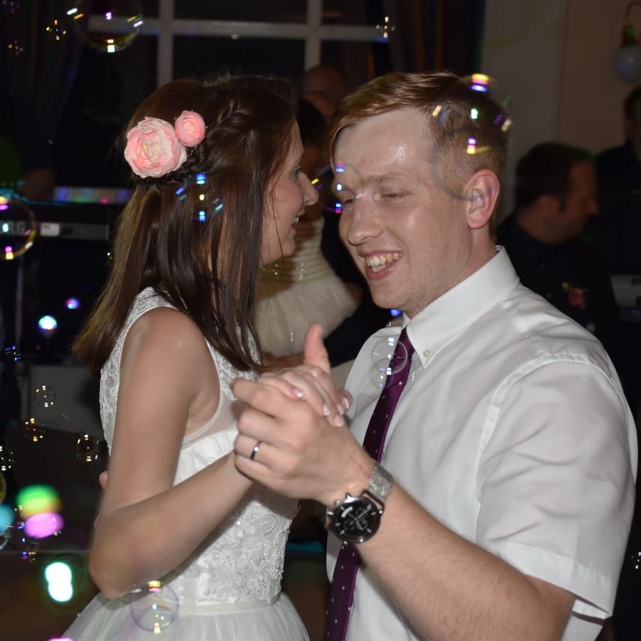 Bubble Machine hire — joyful newlyweds share first dance at wedding | Panda Party Hire Hire bubble machine — joyful newlyweds share first dance at wedding for parties and events in Johannesburg, Sandton and Randburg