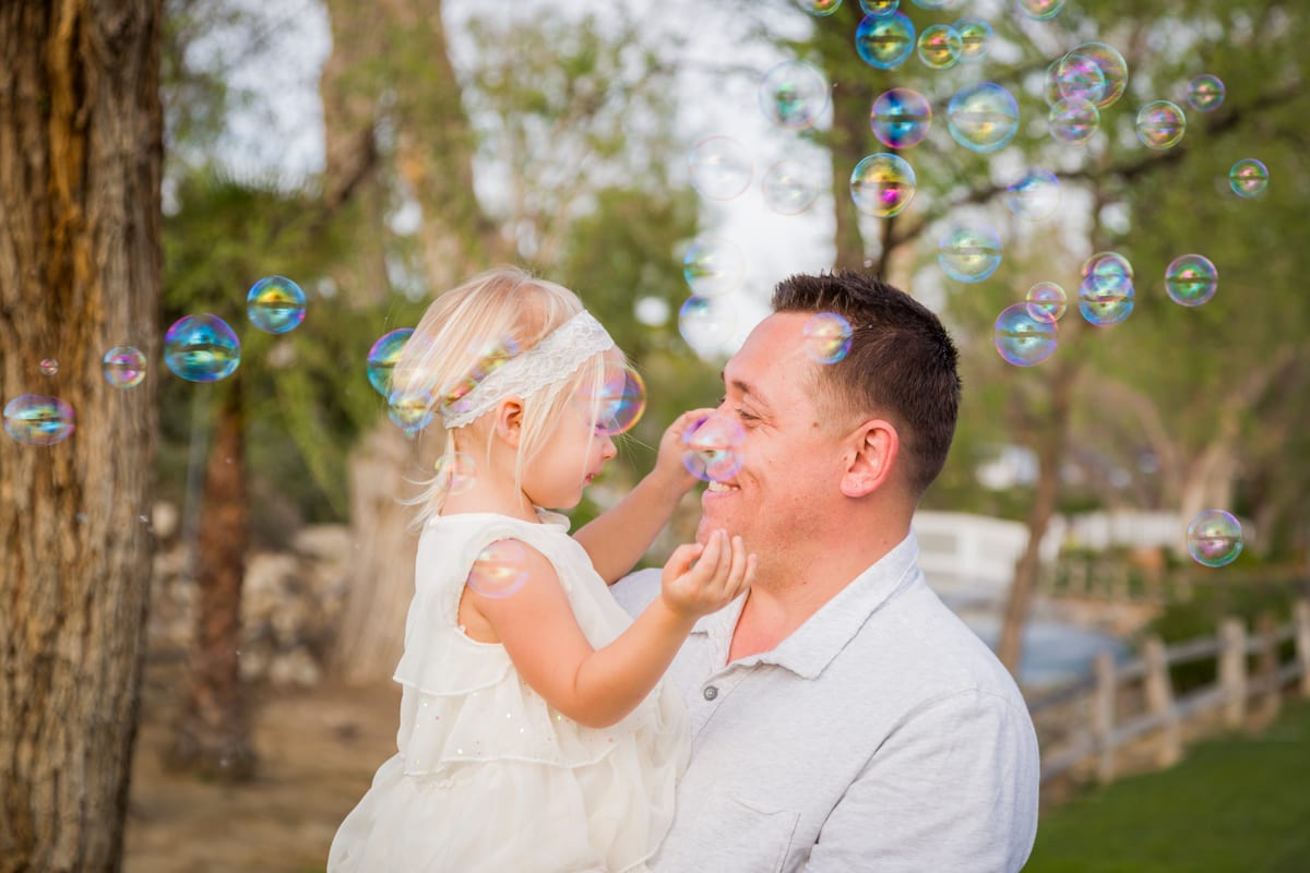 Bubble Machine hire — affectionate father holding cute baby girl enjoyin | Panda Party Hire Hire bubble machine — affectionate father holding cute baby girl enjoyin for parties and events in Johannesburg, Sandton and Randburg