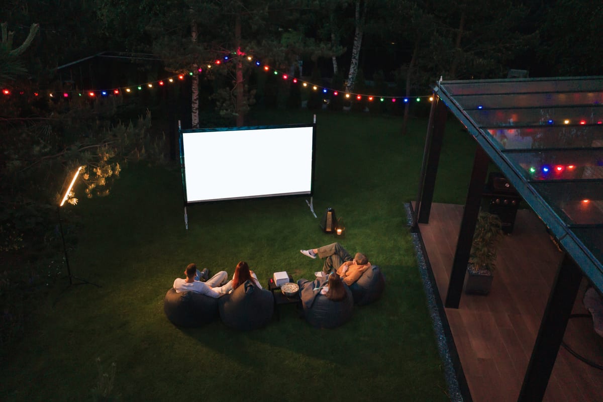 Outdoor Cinema hire — friends enjoying an outdoor movie night | Panda Party Hire Hire outdoor cinema — friends enjoying an outdoor movie night for parties and events in Johannesburg, Sandton and Randburg