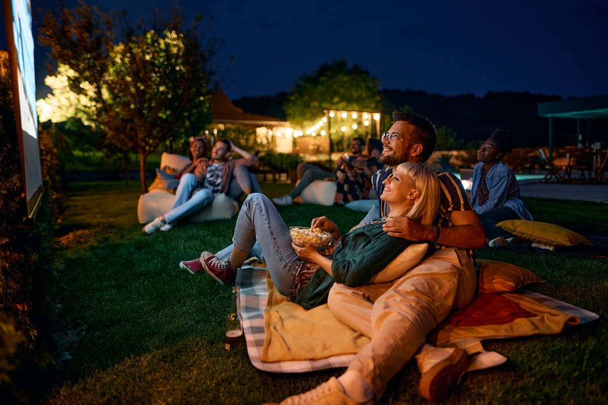 Outdoor Cinema hire — friends enjoying an outdoor movie night together | Panda Party Hire Hire outdoor cinema — friends enjoying an outdoor movie night together for parties and events in Johannesburg, Sandton and Randburg