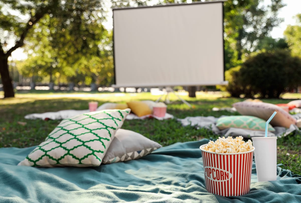 Outdoor Cinema hire — popcorn and drink on blanket in open air cinema s | Panda Party Hire Hire outdoor cinema — popcorn and drink on blanket in open air cinema s for parties and events in Johannesburg, Sandton and Randburg