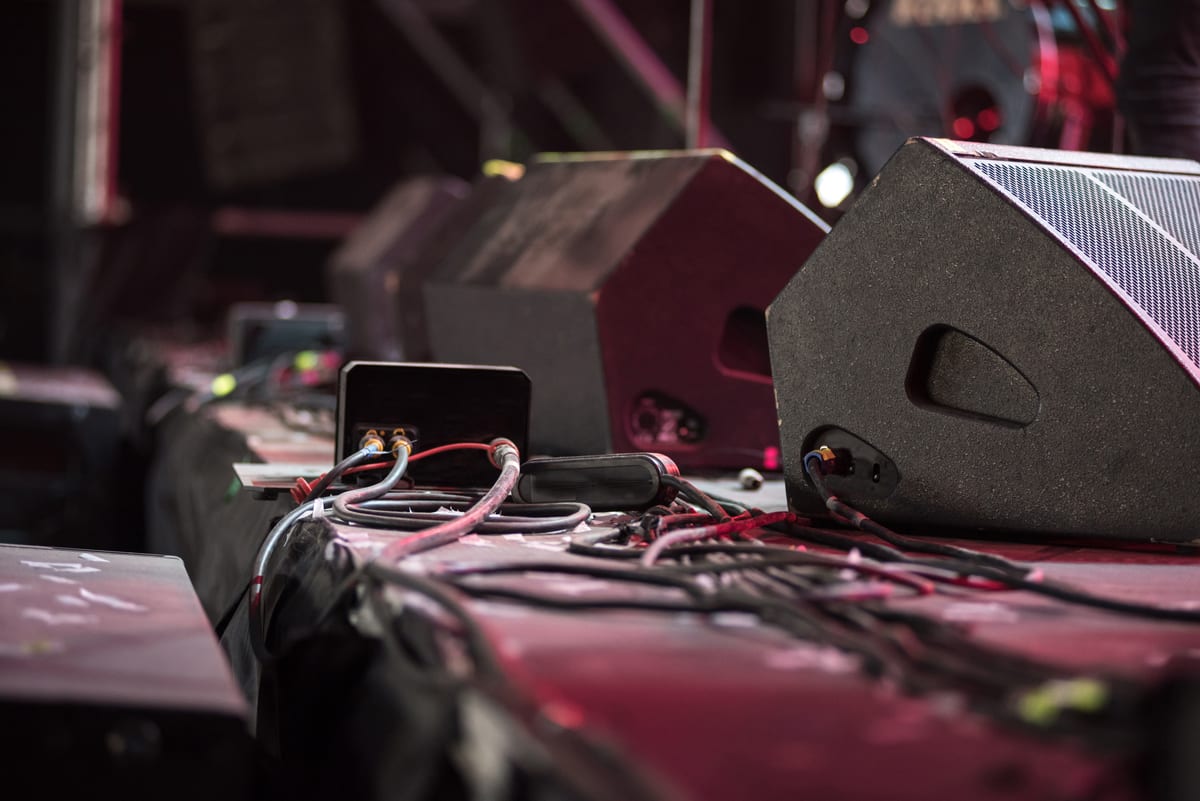 Sound System hire — concert speaker system with audio cables on stage | Panda Party Hire Hire sound system — concert speaker system with audio cables on stage for parties and events in Johannesburg, Sandton and Randburg