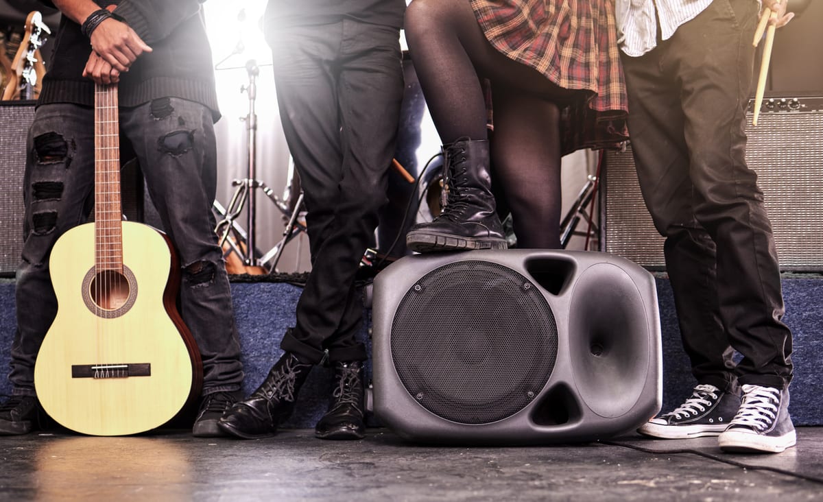 Sound System hire — band posing with instruments and speaker | Panda Party Hire Hire sound system — band posing with instruments and speaker for parties and events in Johannesburg, Sandton and Randburg