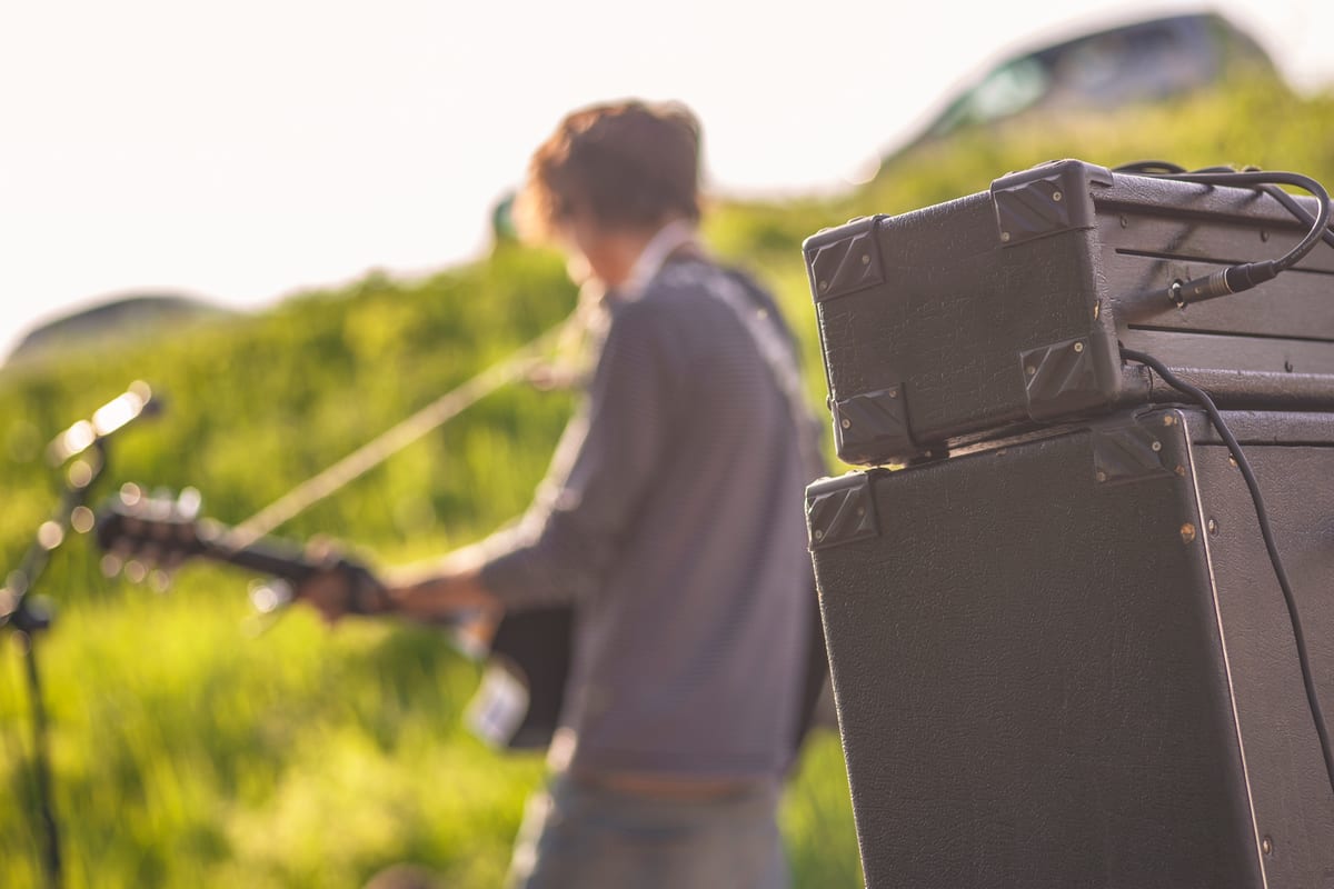 Sound System hire — detail of a rock band s amplifiers with musicians | Panda Party Hire Hire sound system — detail of a rock band s amplifiers with musicians for parties and events in Johannesburg, Sandton and Randburg