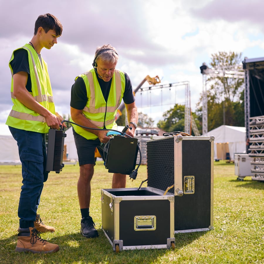 Sound System hire — technicians prepare sound equipment for outdoor pe | Panda Party Hire Hire sound system — technicians prepare sound equipment for outdoor pe for parties and events in Johannesburg, Sandton and Randburg